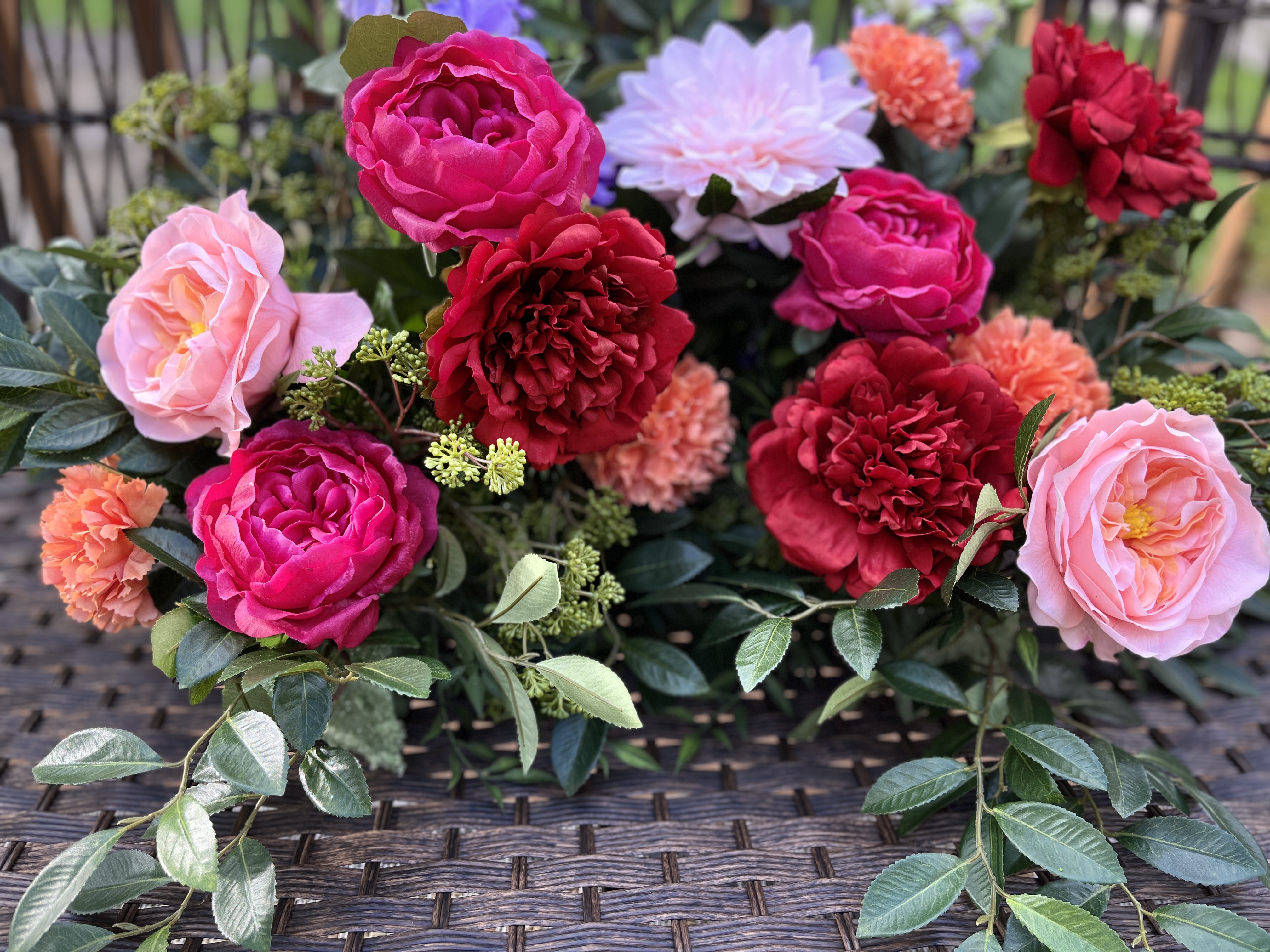 Estate-garden floral arrangement with layered color and movement